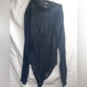 Black lace bodysuit with high neck.